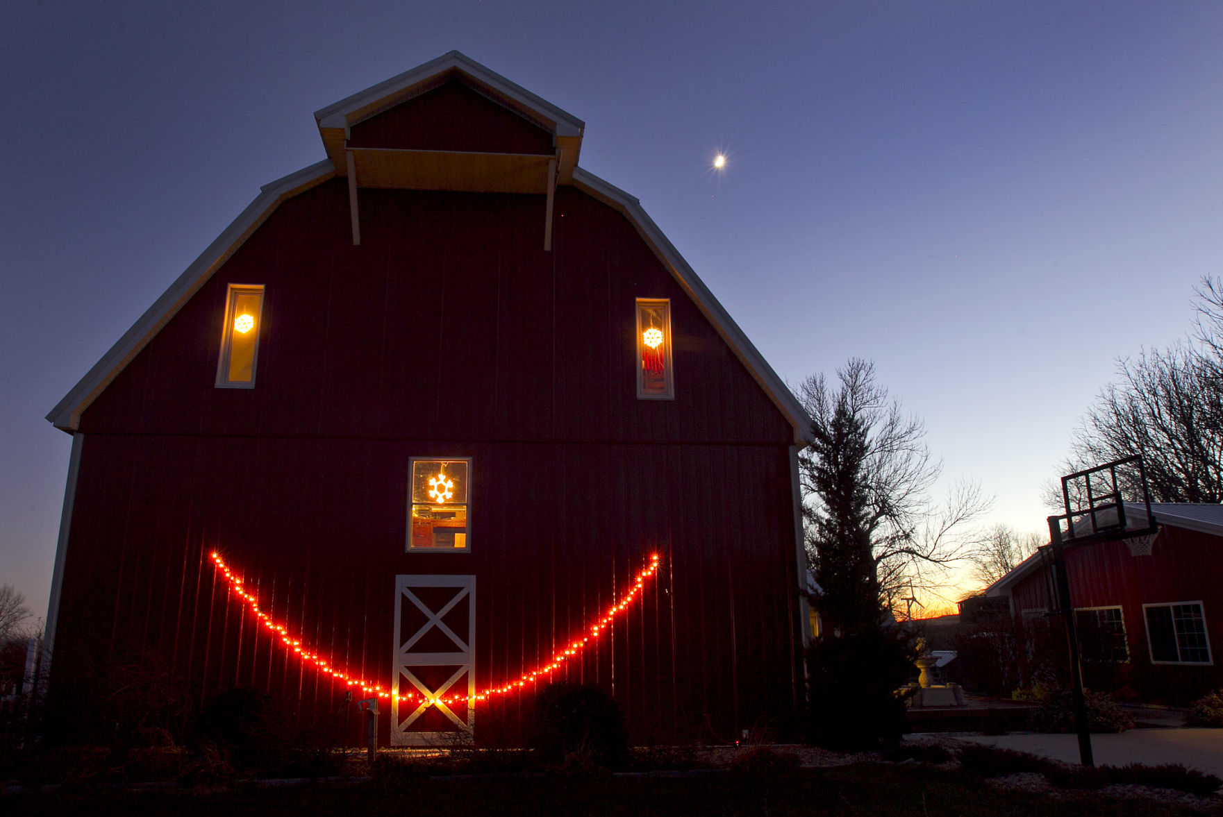 This home at 23561 Barrus Road in Mills County, Iowa, was built out of a barn and cheers passing motorists with its Christmas lights.